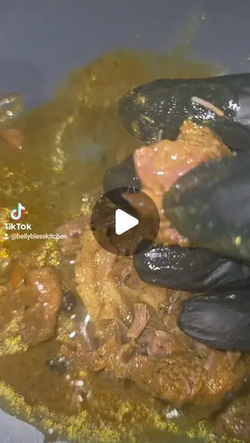 Slow-cooked curry goat, tender enough to pull apart